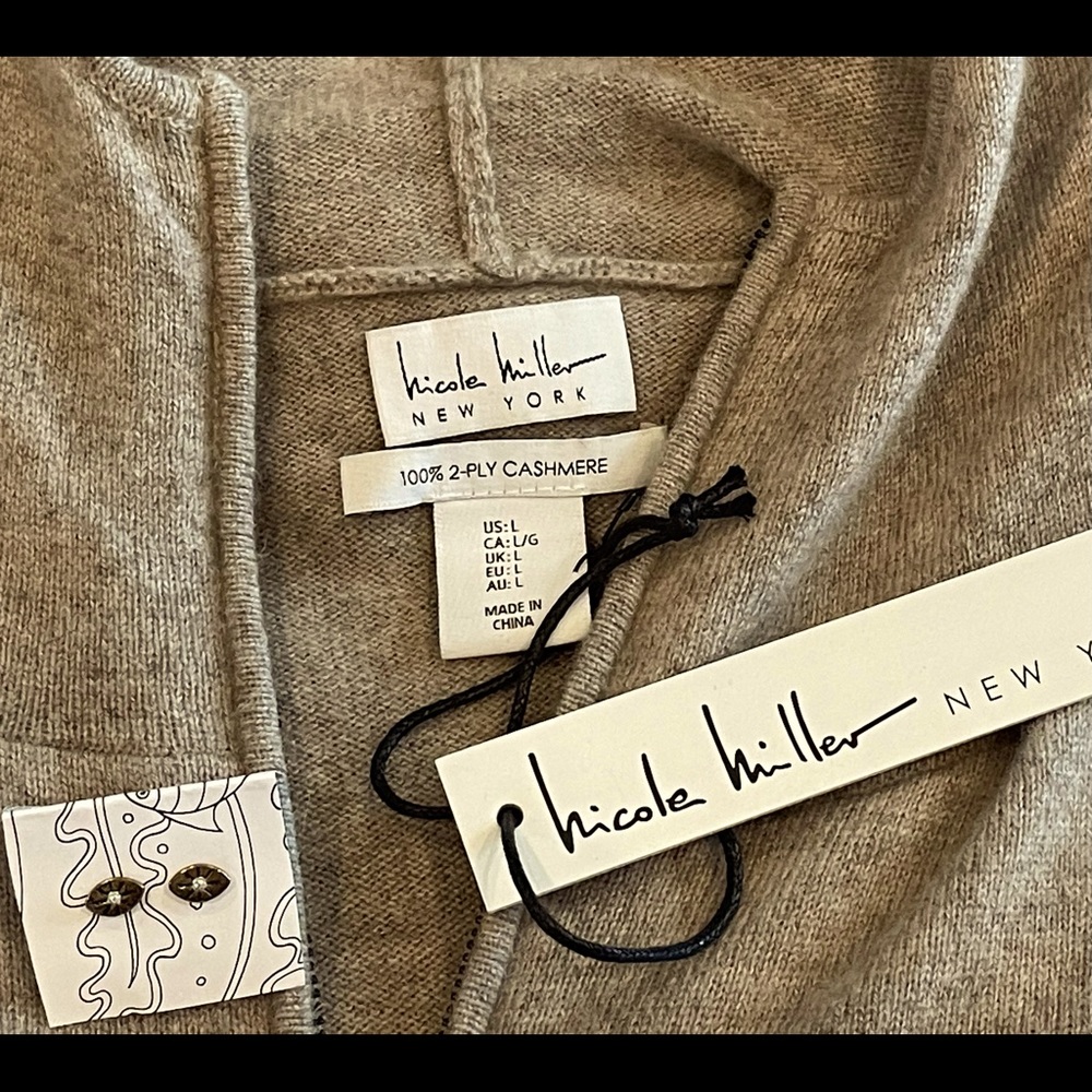 Nicole Miller, new with tags, cashmere tan sweater. Bonus Anthropology earrings!